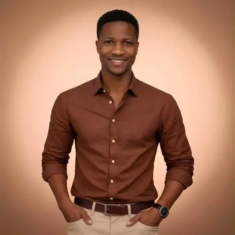 Dave Brown, the website designer behind Web Prince, wearing a brown shirt against a warm beige background
